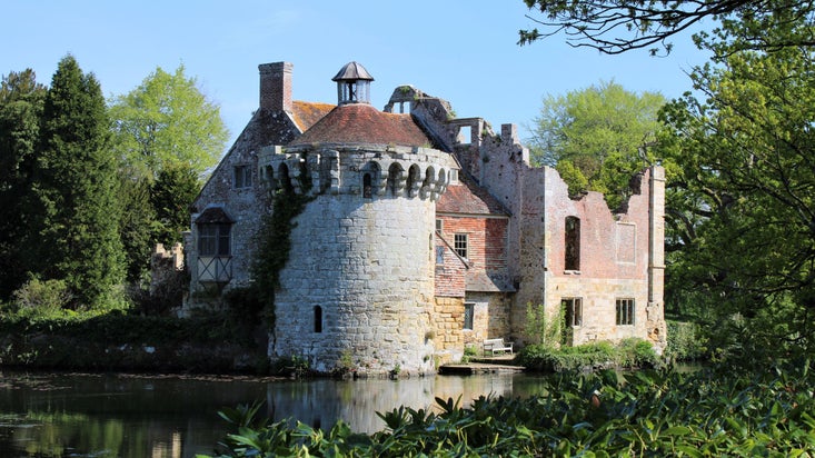 The old castle and moat at Scotney Castle in spring sunshine